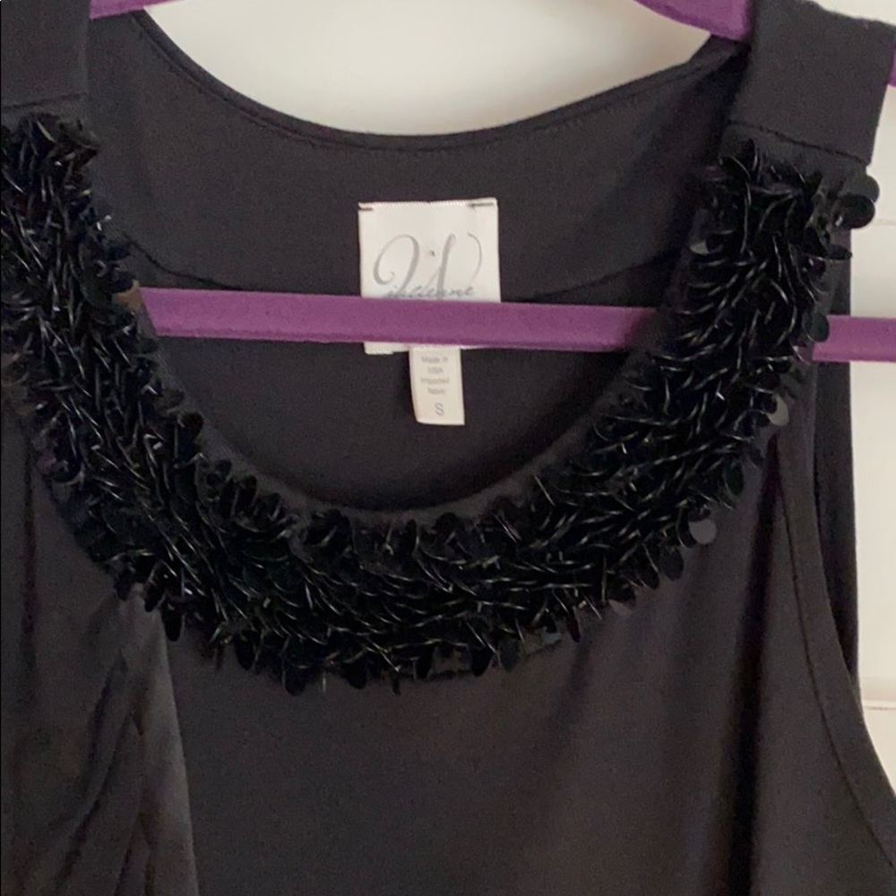 julienne W black dress w/beaded neck trim.